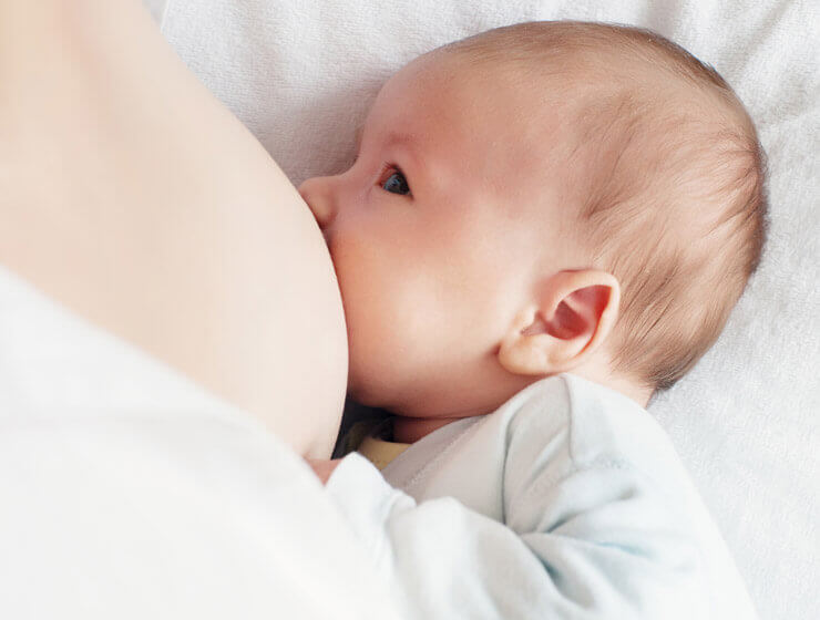 Newborn baby breastfeeding