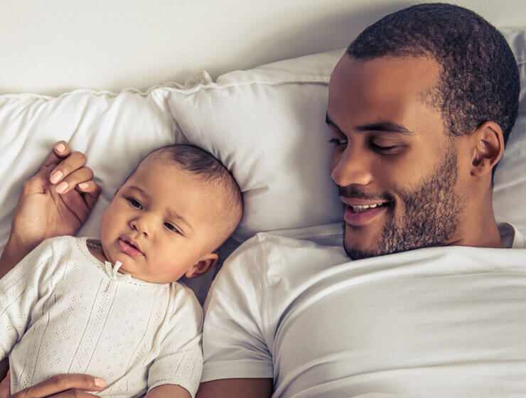 Baby and Dad laying down